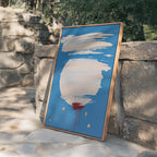 May include: Abstract art piece with a blue background, featuring white brushstrokes and a large white circle. Red paint drips from the bottom, with gold accents. The artwork is framed in a natural wood frame.