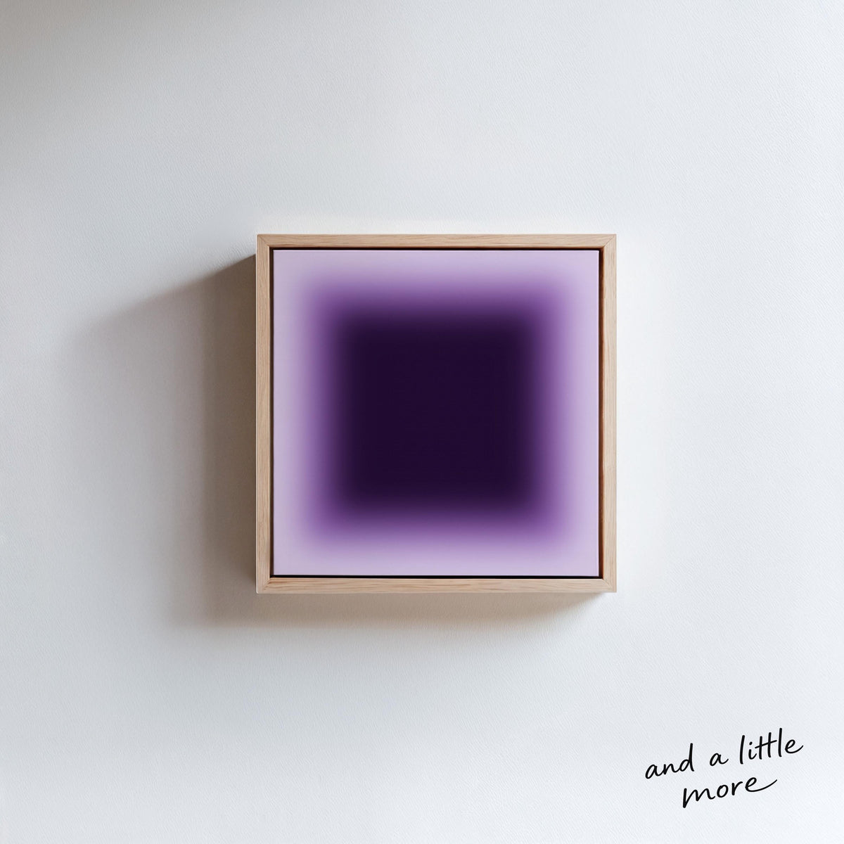 a square-shaped purple object, which appears to be a piece of art or a framed item, hanging on a white wall.