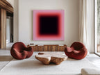 May include: A modern living room featuring a large abstract painting with a gradient of pink to black. Two rounded, rust-colored armchairs face a unique wooden coffee table. A wooden cabinet and a patterned rug complete the stylish interior.