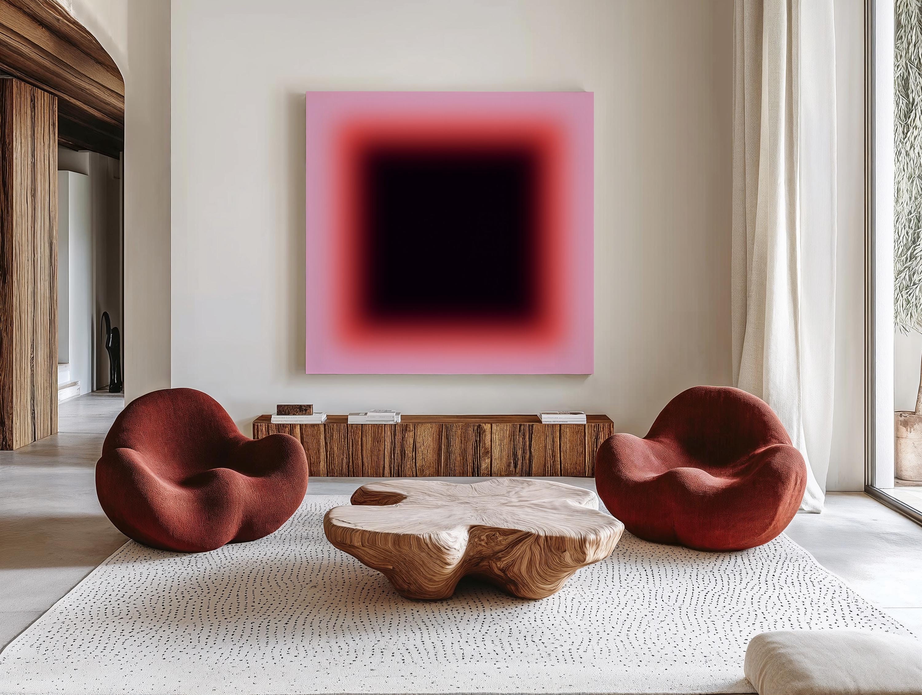 May include: A modern living room featuring a large abstract painting with a gradient of pink to black. Two rounded, rust-colored armchairs face a unique wooden coffee table. A wooden cabinet and a patterned rug complete the stylish interior.
