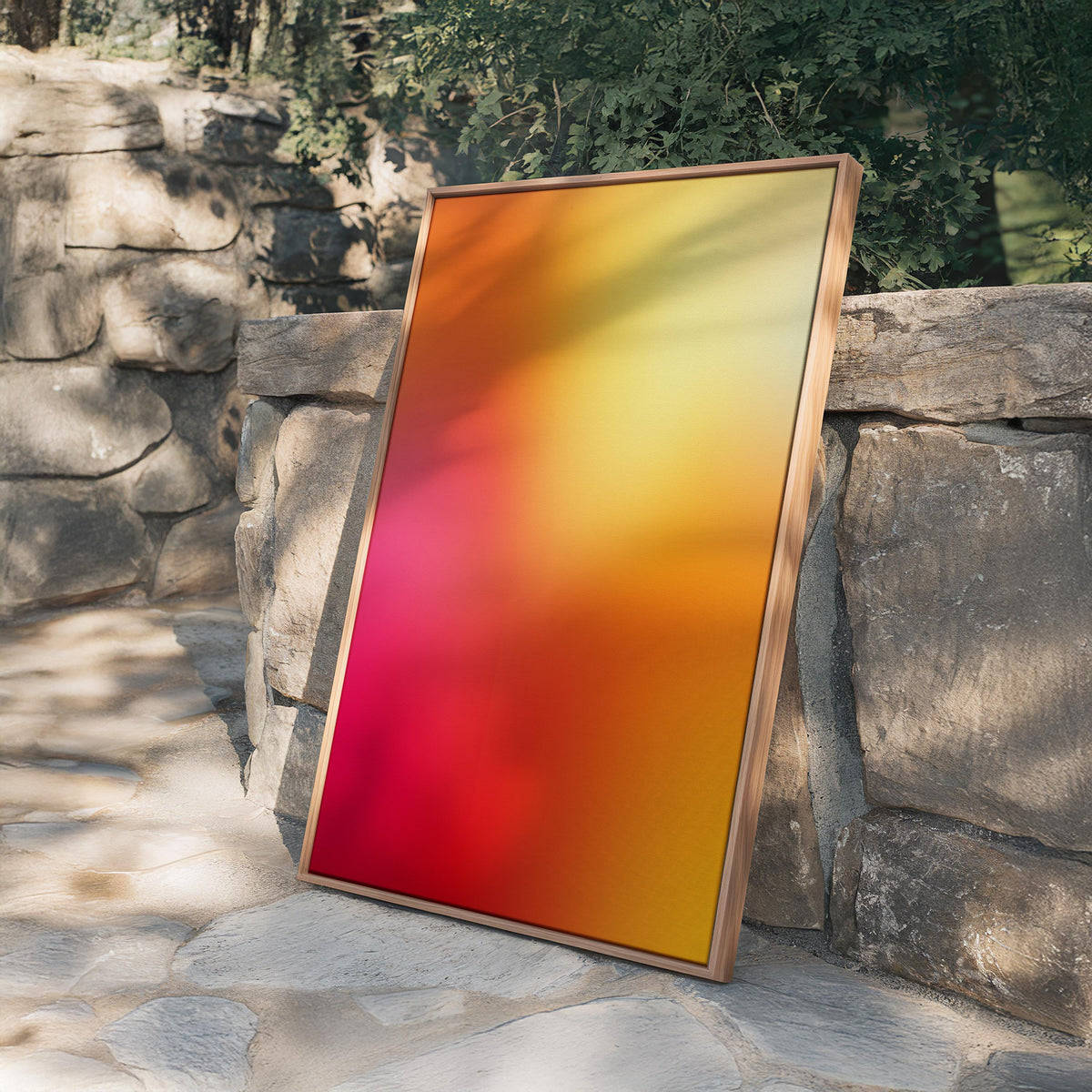 May include: A framed abstract art piece with a vibrant gradient of colors. The artwork transitions from deep red at the bottom to bright yellow at the top, with shades of orange and pink in between. The frame is made of light-colored wood.