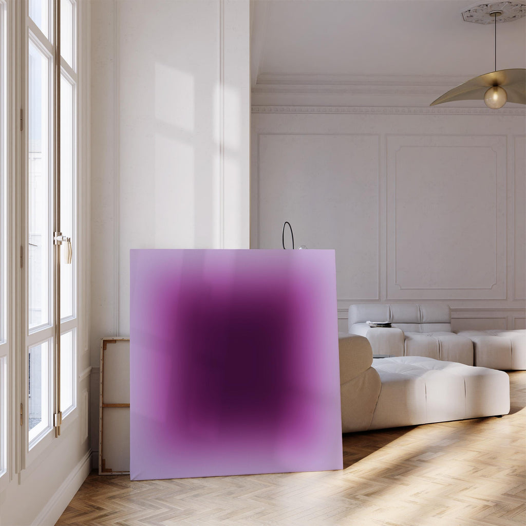 May include: A large square canvas with a gradient of purple hues, transitioning from a deep, dark center to a lighter lavender edge. The artwork is displayed in a bright, modern room with a white sofa and wooden floor.