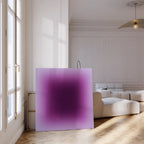 May include: A large square canvas with a gradient of purple hues, transitioning from a deep, dark center to a lighter lavender edge. The artwork is displayed in a bright, modern room with a white sofa and wooden floor.