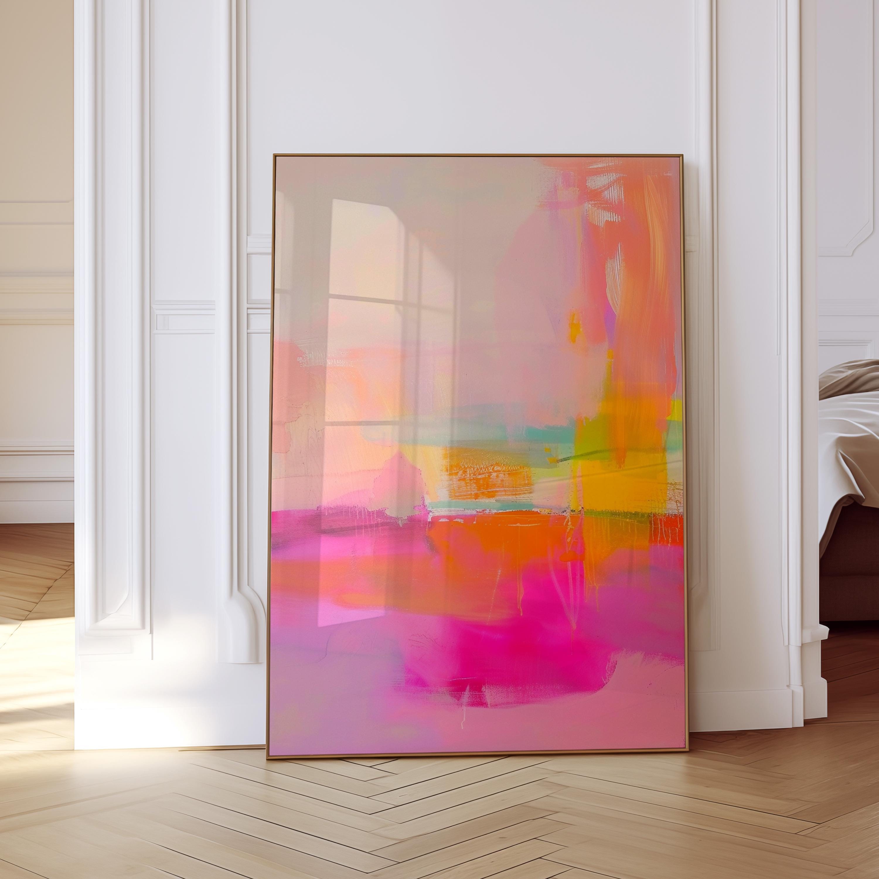 May include: Abstract art print with a vibrant color palette. The artwork features a blend of pink, orange, yellow, and teal hues, creating a dynamic and energetic composition. The framed piece leans against a white wall, adding a modern touch to the space.