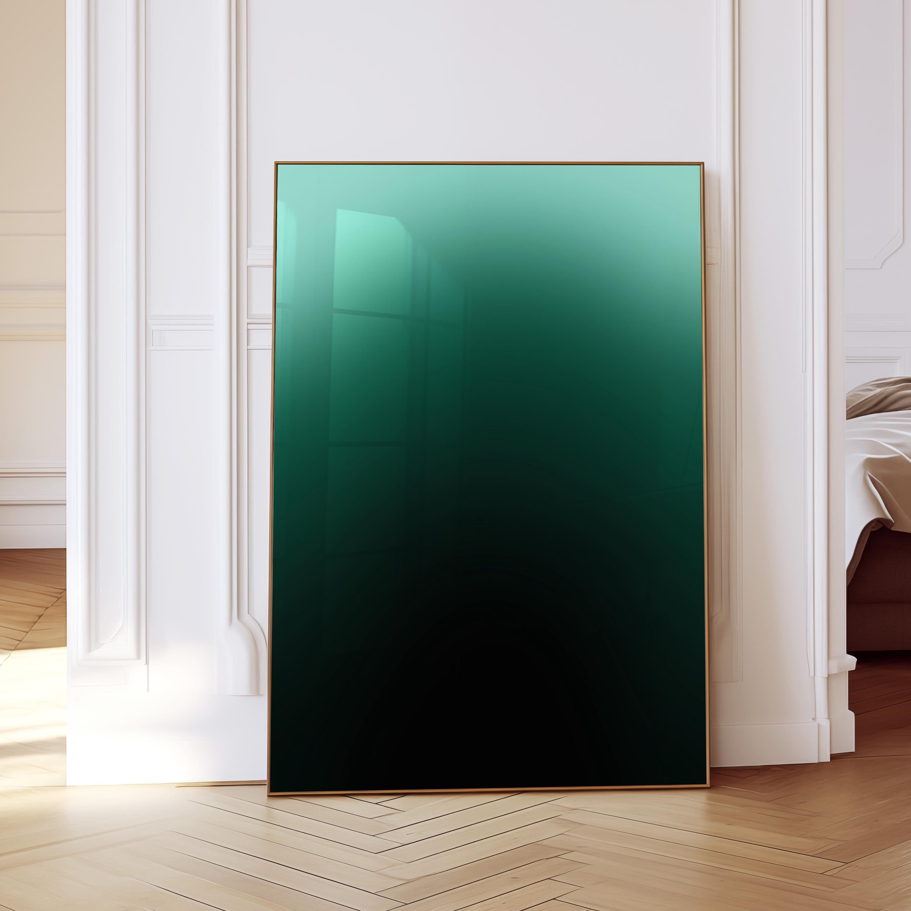 May include: A framed art print featuring a gradient of green to black. The artwork is displayed in a gold frame and leans against a white wall and wooden floor. The gradient art piece adds a modern touch to any room.