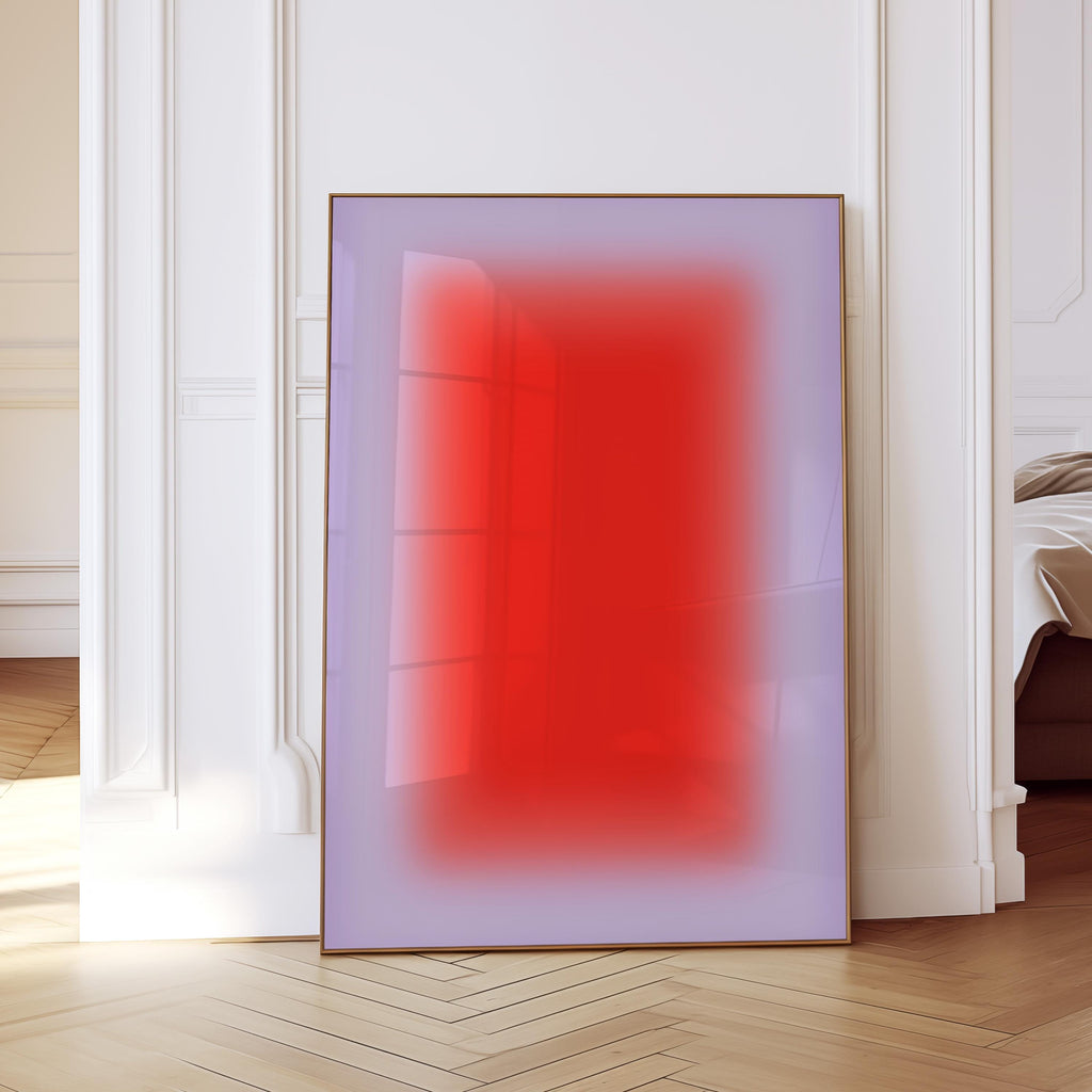 May include: A framed abstract art print featuring a gradient of red and purple hues. The artwork is displayed in a room with white walls and a wooden floor, creating a modern aesthetic. The frame is a warm brown color.