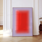 May include: A framed abstract art print featuring a gradient of red and purple hues. The artwork is displayed in a room with white walls and a wooden floor, creating a modern aesthetic. The frame is a warm brown color.
