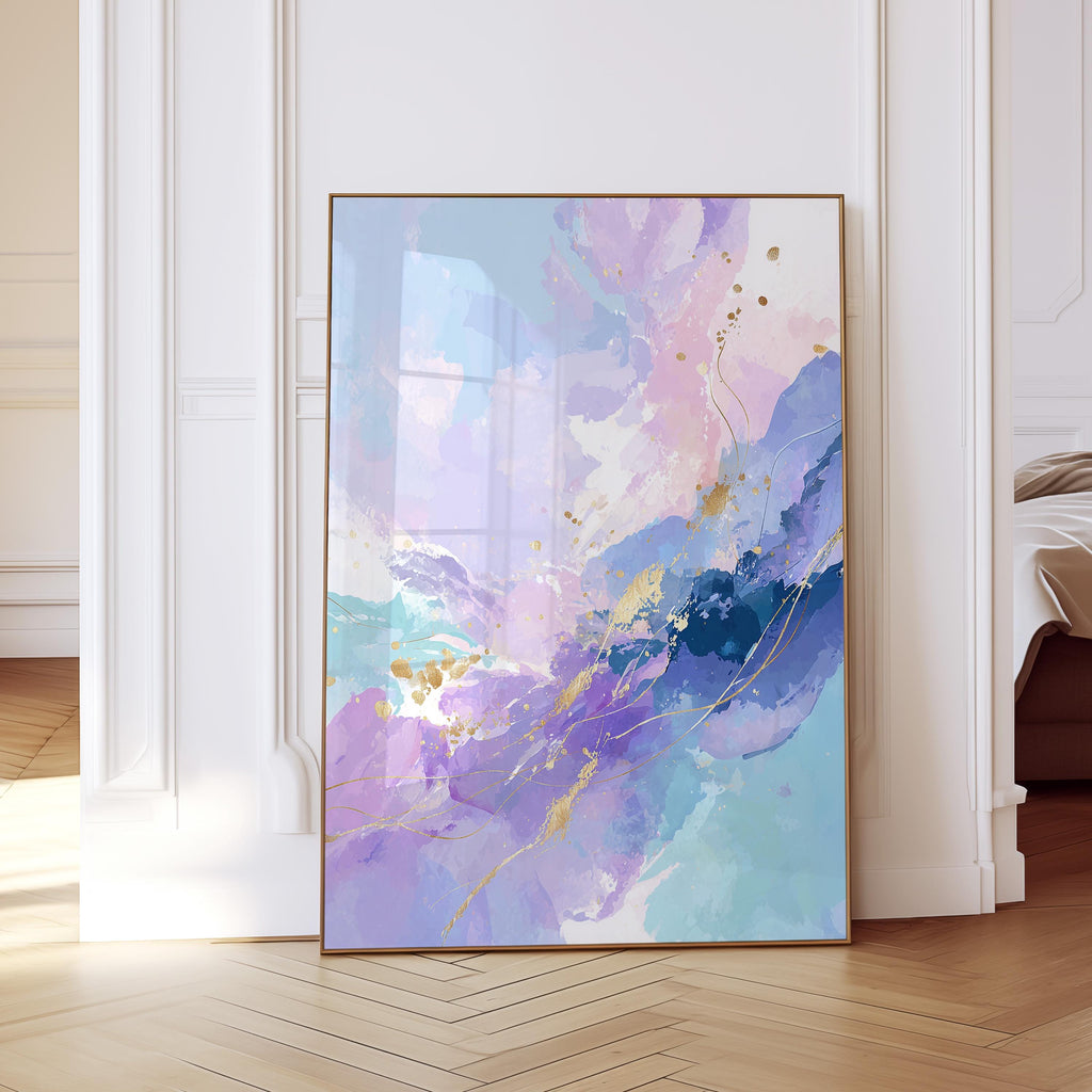May include: Abstract art print featuring a watercolor design in shades of blue, purple, and pink with gold accents. The artwork is framed in a thin, gold-colored frame. The painting is displayed in a room with white walls and a wooden floor.