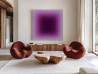May include: A modern living room featuring a large, square purple gradient painting above a wooden cabinet. Two rounded, rust-colored chairs flank a unique wooden coffee table. A neutral rug and white curtains complete the space.