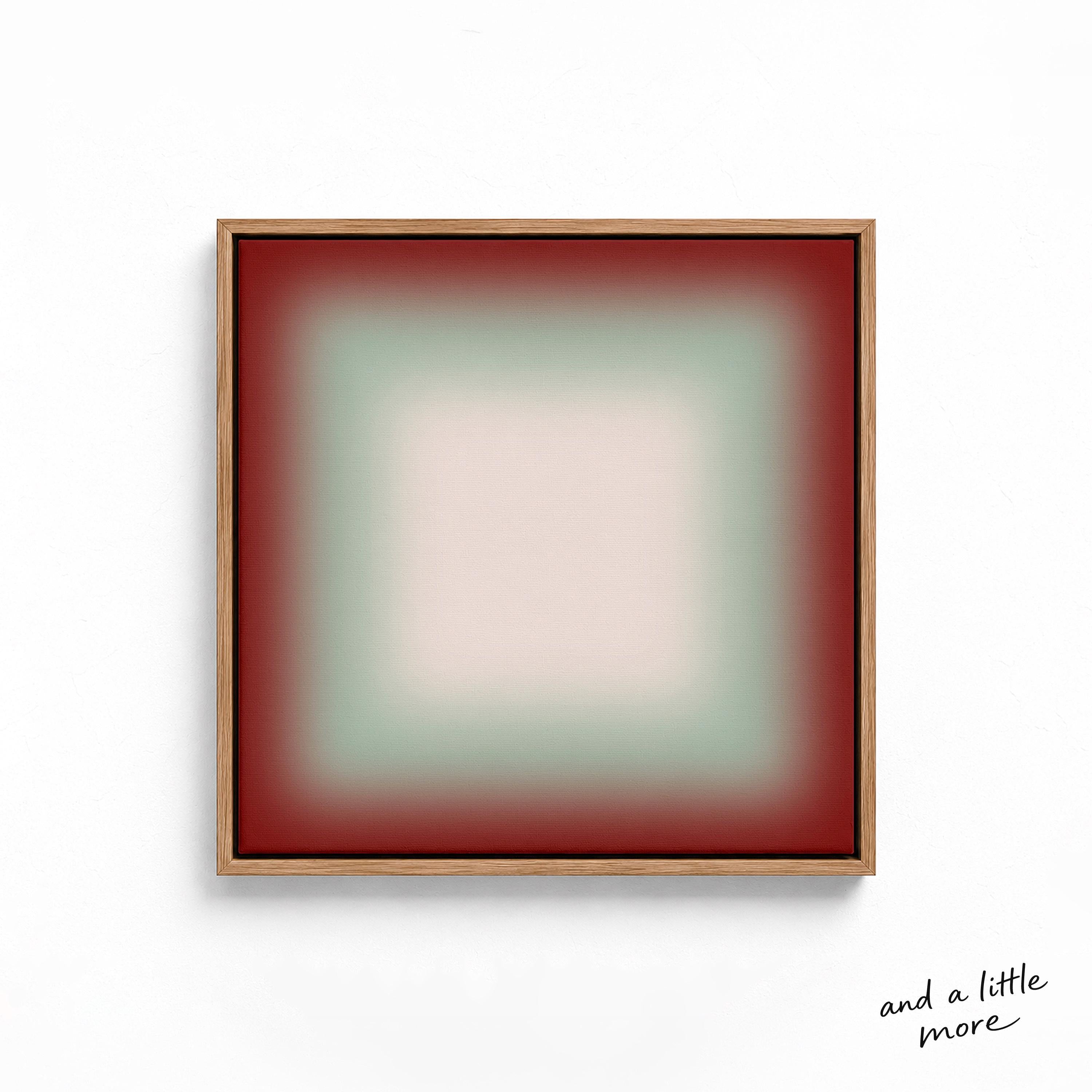 A square, abstract artwork with a gradient background transitioning from red to green. The artwork is framed in a wooden frame and is displayed on a white wall.