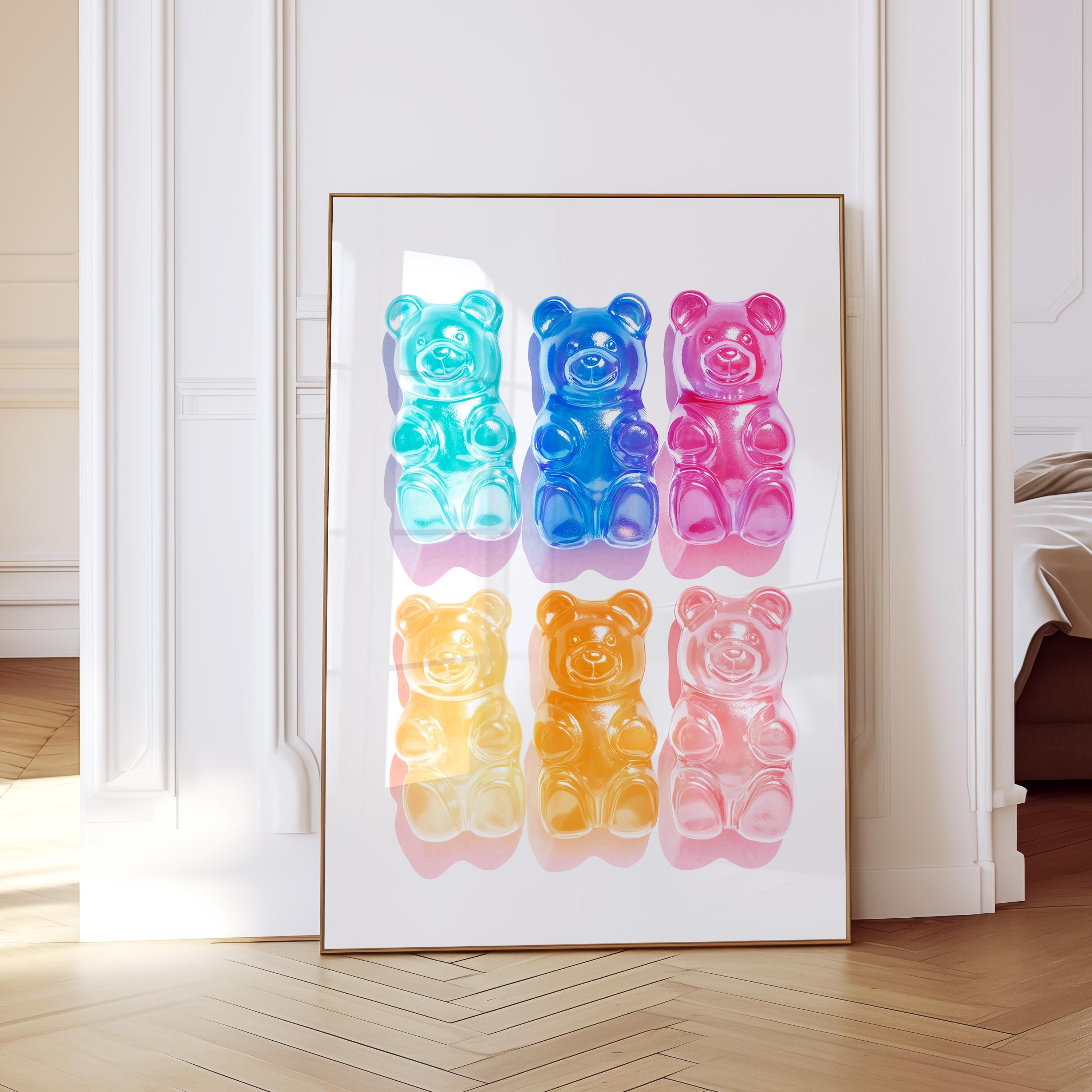May include: A framed print featuring six colorful gummy bear candies. The bears are arranged in two rows of three, with colors including turquoise, blue, pink, yellow, orange, and light pink. The artwork is set against a white background.