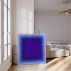 May include: A large, square canvas with a gradient design. The artwork transitions from a light blue outer edge to a deep purple center. The canvas is propped against a wall in a well-lit room with a hardwood floor.