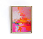 May include: Abstract art print in a gold frame. The artwork features a vibrant mix of colors, including pink, orange, yellow, and blue. The painting has a textured appearance with visible brushstrokes, creating a dynamic and energetic composition.