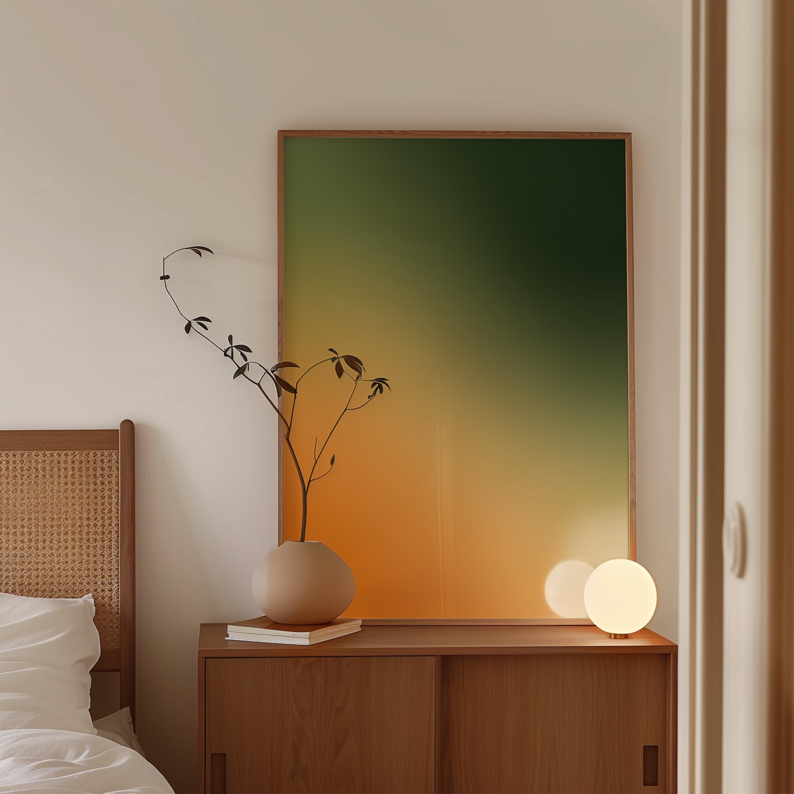 May include: A wooden cabinet with sliding doors holds a beige vase with a sprig of leaves, a stack of books, and a glowing orb lamp. A large framed artwork with a green and orange gradient hangs on the wall.