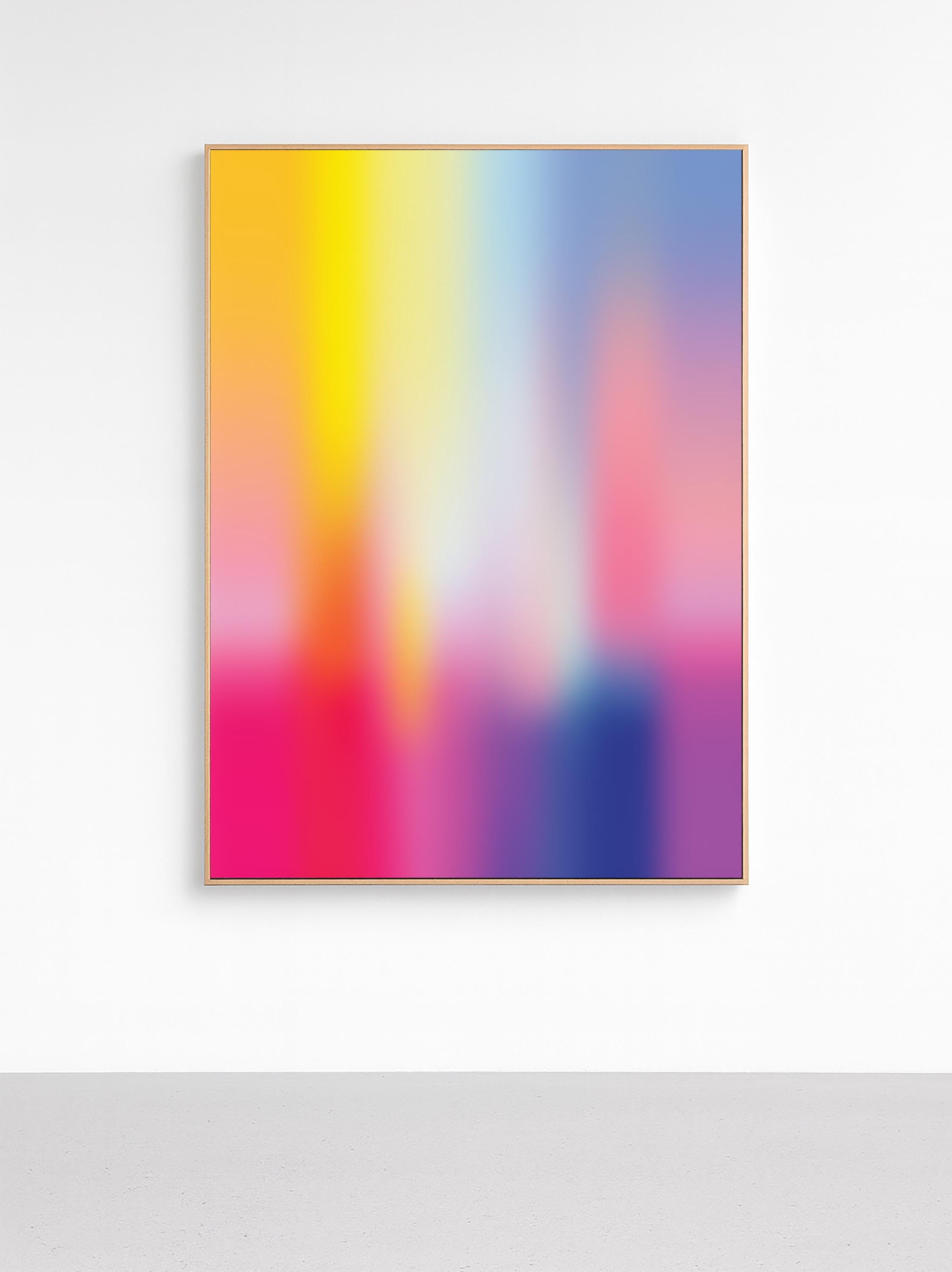 May include: Abstract art print featuring a vibrant gradient of colors. The artwork transitions from yellow and orange at the top to pink, purple, and blue at the bottom. The piece is framed in a thin, natural wood frame.